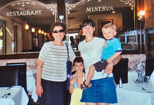 Voula in front of family Greek restaurant