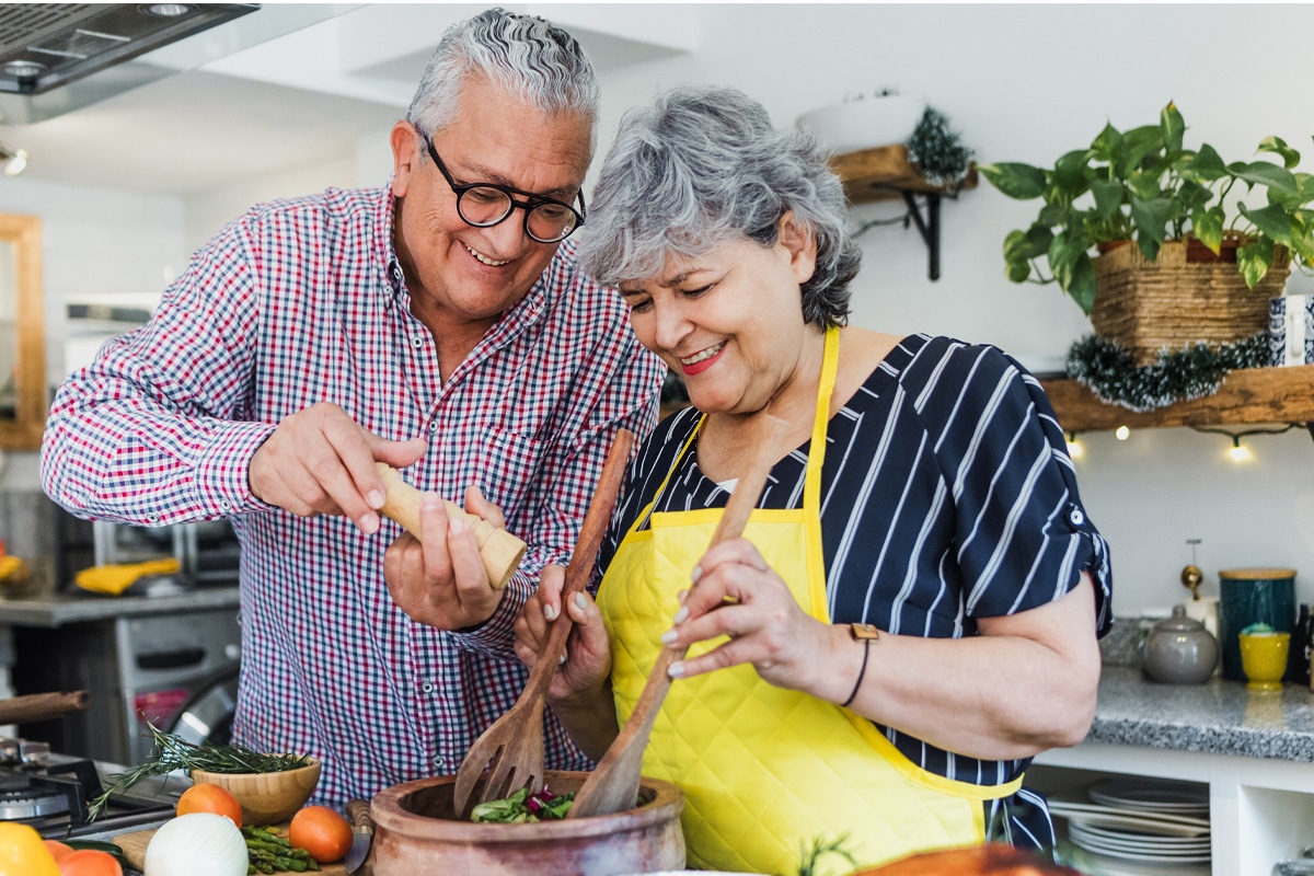 couple prepares low-sugar meal in kitchen