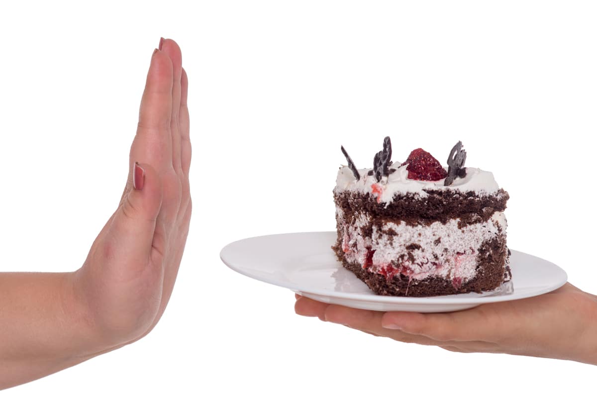 emotional eating concept - saying no to cake