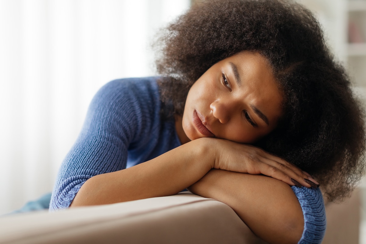 glp-1 side effect concept - woman tired on the couch