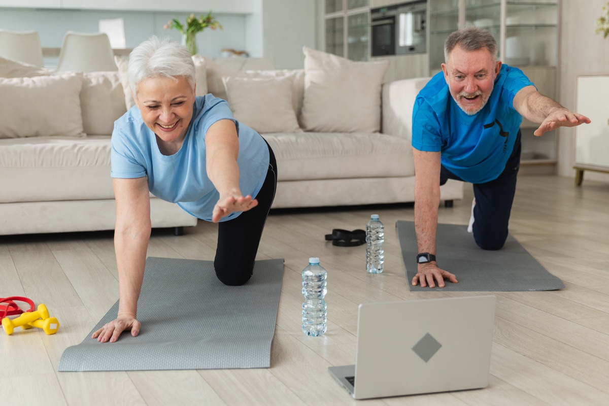 mature couple resistance training at home