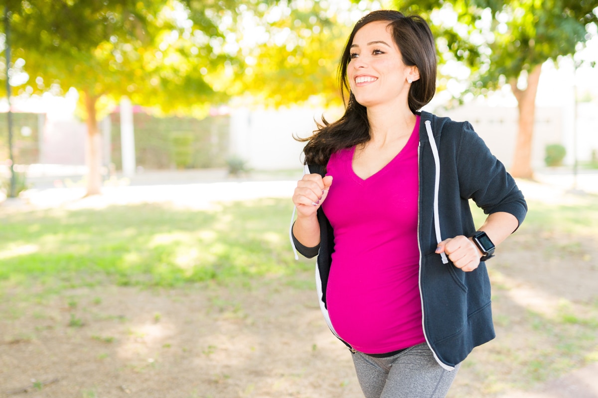 pregnant woman jogging - protein in your 20's concept